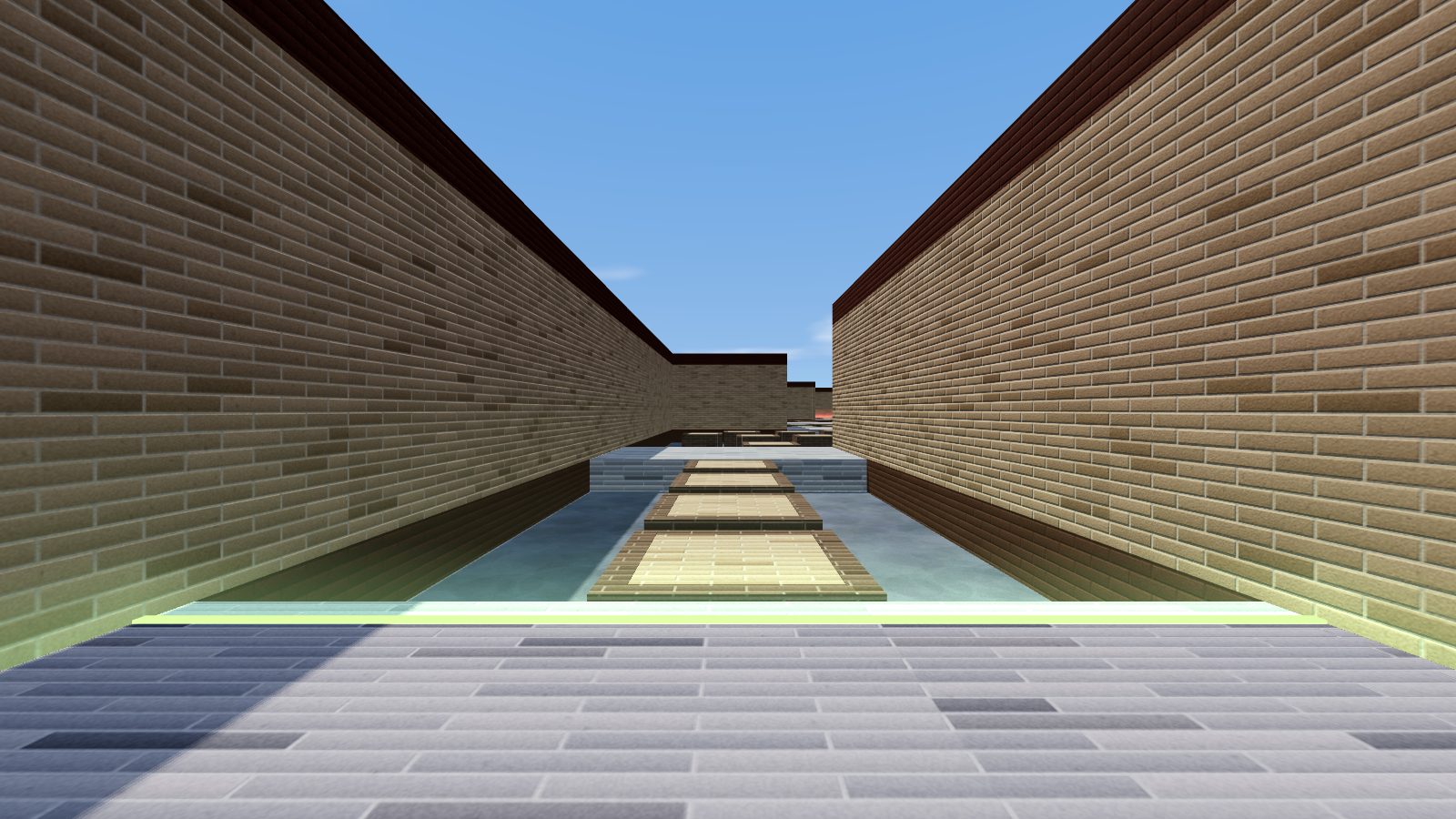 First-person view down the brick corridor of bhop_brick, with bhop blocks leading to the first checkpoint.